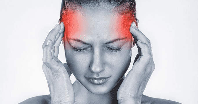 Person holding neck showing cervicogenic headache pain pattern