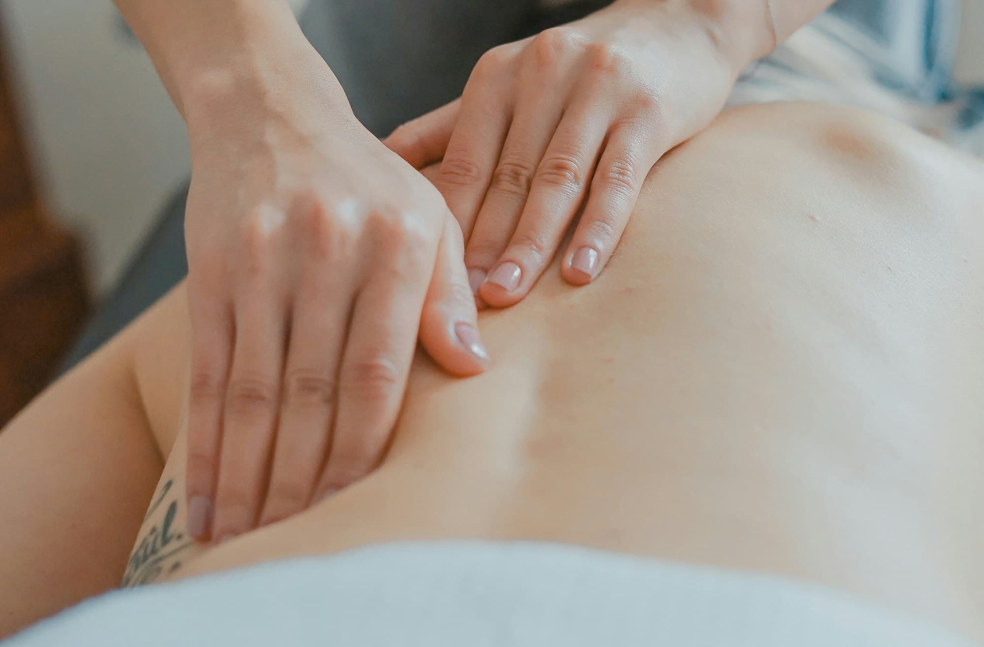 Soft tissue mobilization therapy on a patient